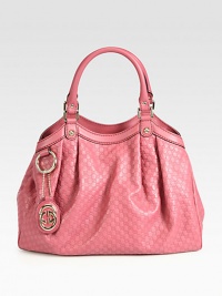 Some totes have all the fun. The Sukey carry-all will take you from day to night and into the weekend.Dark pink soft microguccissima leatherDark pink leather trimLight fine gold hardwareDouble handles, 7 dropTab snap closure and side snapsDetachable interlocking G leather tagInterior zip pocketNatural cotton linen liningMedium size: 13W x 9.8H x 4.3DMade in Italy Some totes have all the fun. The Sukey carry-all will take you from day to night and into the weekend.Dark pink soft microguccissima leatherDark pink leather trimLight fine gold hardwareDouble handles, 7 dropTab snap closure and side snapsDetachable interlocking G leather tagInterior zip pocketNatural cotton linen liningMedium size: 13W x 9.8H x 4.3DMade in Italy