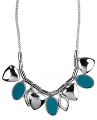 A colorful infusion. Nine West's pretty necklace features leaf-shaped charms and teal enamel ovals for a bright pop of color. Set in silver tone mixed metal. Approximate length: 16 inches + 2-inch extender. Approximate drop length: 1 inch. Approximate drop width: 5-3/4 inches. A colorful infusion. Nine West's pretty necklace features leaf-shaped charms and teal enamel ovals for a bright pop of color. Set in silver tone mixed metal. Approximate length: 16 inches + 2-inch extender. Approximate drop length: 1 inch. Approximate drop width: 5-3/4 inches.