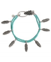 Turn over a stylish new leaf. This charm bracelet from Lucky Brand is crafted from silver-tone mixed metal with turquoise beads and leaf accents adding a whimsical pop. Approximate length: 7-5/8 inches. Turn over a stylish new leaf. This charm bracelet from Lucky Brand is crafted from silver-tone mixed metal with turquoise beads and leaf accents adding a whimsical pop. Approximate length: 7-5/8 inches.