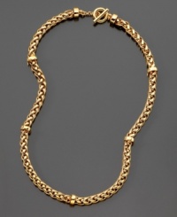 Strength and beauty are embodied in this classic woven goldtone toggle necklace by Lauren Ralph Lauren. Approximate length: 18 inches. Strength and beauty are embodied in this classic woven goldtone toggle necklace by Lauren Ralph Lauren. Approximate length: 18 inches.