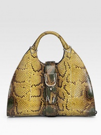 Genuine python, finished with side strap details and a stirrup strap closure.Double top handles, 5 drop Stirrup snap and side hook closures Protective metal feet Inside zip, snap, cell phone and PDA pockets Leather lining 15½W X 9½H X 6½D Made in Italy Genuine python, finished with side strap details and a stirrup strap closure.Double top handles, 5 drop Stirrup snap and side hook closures Protective metal feet Inside zip, snap, cell phone and PDA pockets Leather lining 15½W X 9½H X 6½D Made in Italy