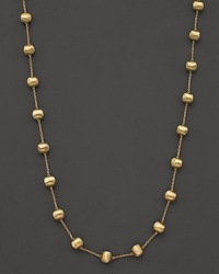 Textured bead stations lend bold style to this 18 karat gold necklace from Marco Bicego. Textured bead stations lend bold style to this 18 karat gold necklace from Marco Bicego.