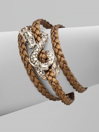 From the Naga Collection. A braid of rich leather wraps the wrist three times while weaving in and out of a curvaceous silver dragon.LeatherSterling silverLength, about 6½Lobster claspMade in Bali From the Naga Collection. A braid of rich leather wraps the wrist three times while weaving in and out of a curvaceous silver dragon.LeatherSterling silverLength, about 6½Lobster claspMade in Bali