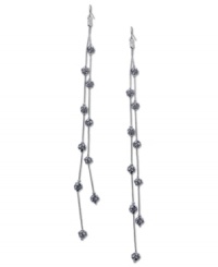 Fire up your evening with these two-row linear earrings from GUESS. Crystal-embellished fireballs hang from metal chains. Crafted in imitation rhodium tone mixed metal. Approximate drop: 7 inches. Fire up your evening with these two-row linear earrings from GUESS. Crystal-embellished fireballs hang from metal chains. Crafted in imitation rhodium tone mixed metal. Approximate drop: 7 inches.