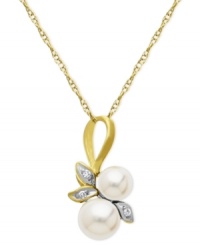 A natural choice. This pendant, crafted from 10k gold, exudes elegance with cultured freshwater pearls (5-6 mm) and diamond accents along a whimsical leaf motif. Approximate length: 18 inches. Approximate drop length: 3/4 inch. Approximate drop width: 1/3 inch. A natural choice. This pendant, crafted from 10k gold, exudes elegance with cultured freshwater pearls (5-6 mm) and diamond accents along a whimsical leaf motif. Approximate length: 18 inches. Approximate drop length: 3/4 inch. Approximate drop width: 1/3 inch.