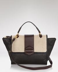 In contrasting tonal leathers, MARC BY MARC JACOBS latest top handle style is a cool, hold-it-all take on the color block trend. In contrasting tonal leathers, MARC BY MARC JACOBS latest top handle style is a cool, hold-it-all take on the color block trend.