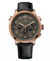 Present at a conference, close the deal and grab dinner all in a day's work. Watch by Tommy Hilfiger crafted of black leather strap and round rose-gold-plated stainless steel case. Black chronograph dial with textured inner dial features rose-gold tone numerals, three subdials, luminous hands and logo at twelve o'clock. Quartz movement. Water resistant to 50 meters. Limited lifetime warranty. Present at a conference, close the deal and grab dinner all in a day's work. Watch by Tommy Hilfiger crafted of black leather strap and round rose-gold-plated stainless steel case. Black chronograph dial with textured inner dial features rose-gold tone numerals, three subdials, luminous hands and logo at twelve o'clock. Quartz movement. Water resistant to 50 meters. Limited lifetime warranty.