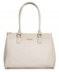 Ladylike with elegant accents, this Calvin Klein satchel stylishly totes your everyday essentials with ease. Sumptuous Saffiano leather is the perfect backdrop for subtle golden hardware and detail stitching. It's the perfect accessory for any occasion. Ladylike with elegant accents, this Calvin Klein satchel stylishly totes your everyday essentials with ease. Sumptuous Saffiano leather is the perfect backdrop for subtle golden hardware and detail stitching. It's the perfect accessory for any occasion.