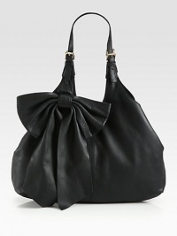 A feminine design with a slouchy chic style in supple leather accented with a large bow.Double adjustable shoulder straps, 9½-12½ dropMagnetic snap closure with center strapOne inside zip pocketCotton lining16W X 11½H X 4DMade in Italy A feminine design with a slouchy chic style in supple leather accented with a large bow.Double adjustable shoulder straps, 9½-12½ dropMagnetic snap closure with center strapOne inside zip pocketCotton lining16W X 11½H X 4DMade in Italy