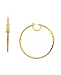 Golden tones with subtle sparkle. These hoop earrings from Vince Camuto are embellished with shimmering crystal stones. Crafted in gold tone mixed metal. Approximate diameter: 2-1/2 inch. Golden tones with subtle sparkle. These hoop earrings from Vince Camuto are embellished with shimmering crystal stones. Crafted in gold tone mixed metal. Approximate diameter: 2-1/2 inch.
