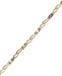 All the colors of the rainbow. Victoria Townsend's oval link bracelet features oval-cut amethyst (1/2 ct. t.w.), blue topaz (1/4 ct. t.w.), citrine (1/5 ct. t.w.), garnet (1/2 ct. t.w.), peridot (1/4 ct. t.w.) and diamond accents. Set in 18k gold over sterling silver. Approximate length: 7-1/4 inches. All the colors of the rainbow. Victoria Townsend's oval link bracelet features oval-cut amethyst (1/2 ct. t.w.), blue topaz (1/4 ct. t.w.), citrine (1/5 ct. t.w.), garnet (1/2 ct. t.w.), peridot (1/4 ct. t.w.) and diamond accents. Set in 18k gold over sterling silver. Approximate length: 7-1/4 inches.