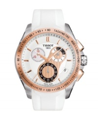 An watch of contrast by Tissot, the Veloci-T is as precisely functional as it is chic. White rubber strap and round stainless steel case. Goldtone PVD-plated bezel with tachymeter scale. White chronograph dial features goldtone stick indices, date window at four o'clock, luminous goldtone hands, black logo and three subdials accented in goldtone, black and red. Swiss movement. Water resistant to 100 meters. Two-year limited warranty. An watch of contrast by Tissot, the Veloci-T is as precisely functional as it is chic. White rubber strap and round stainless steel case. Goldtone PVD-plated bezel with tachymeter scale. White chronograph dial features goldtone stick indices, date window at four o'clock, luminous goldtone hands, black logo and three subdials accented in goldtone, black and red. Swiss movement. Water resistant to 100 meters. Two-year limited warranty.