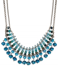 A pretty palette of blue ombre glass beads (4-10 mm) decorate this chic frontal necklace from c.A.K.e. by Ali Khan. Crafted in gold tone mixed metal. Approximate length: 14 inches + 3-inch extender. Approximate drop: 1-3/4 inches. A pretty palette of blue ombre glass beads (4-10 mm) decorate this chic frontal necklace from c.A.K.e. by Ali Khan. Crafted in gold tone mixed metal. Approximate length: 14 inches + 3-inch extender. Approximate drop: 1-3/4 inches.