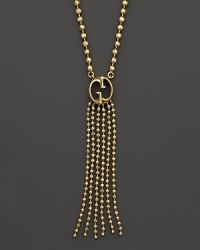 With timeless appeal, Gucci's heritage 1973 pendant necklace offers a classic look with the brand's signature logo in 18K yellow gold. With timeless appeal, Gucci's heritage 1973 pendant necklace offers a classic look with the brand's signature logo in 18K yellow gold.