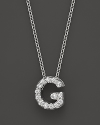 From the Tiny Treasures collection, a diamond G necklace. With signature ruby accent. Designed by Roberto Coin. From the Tiny Treasures collection, a diamond G necklace. With signature ruby accent. Designed by Roberto Coin.