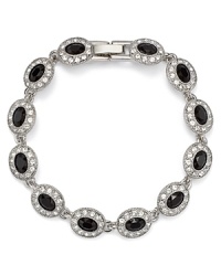 This Carolee bracelet styles your look with effortless elegance, accented by jet stone stations, specially faceted for added allure. This Carolee bracelet styles your look with effortless elegance, accented by jet stone stations, specially faceted for added allure.