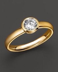 Extraordinary brilliance. This beautifully crafted diamond ring features a bezel-set brilliant round stone. Extraordinary brilliance. This beautifully crafted diamond ring features a bezel-set brilliant round stone.