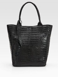 Luxurious croc-skin crafted in a roomy carryall and finished with leaf cut-out tassels.Double top handles, 8 drop Magnetic closure One inside zip pocket One cell phone pocket Suede lining 12W X 14½H X 5½D Imported Luxurious croc-skin crafted in a roomy carryall and finished with leaf cut-out tassels.Double top handles, 8 drop Magnetic closure One inside zip pocket One cell phone pocket Suede lining 12W X 14½H X 5½D Imported