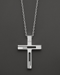 Sterling silver forms an elegant cross pendant. Sterling silver forms an elegant cross pendant.