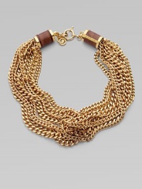 This chunky style is enhanced by croc-print leather inlay barrel caps. Brass Length, about 19 Lobster clasp closure with logo lock Imported This chunky style is enhanced by croc-print leather inlay barrel caps. Brass Length, about 19 Lobster clasp closure with logo lock Imported