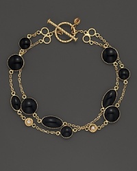 Two rows of black enamel stations and diamond accents highlight this bracelet from Roberto Coin. Two rows of black enamel stations and diamond accents highlight this bracelet from Roberto Coin.