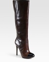Strut-worthy leather boots with a glossy patent cap toe and soaring heel. Self-covered heel, 4¾ (120mm)Covered platform, ½ (15mm)Compares to a 4¼ heel (110mm)Shaft, 15Leg circumference, 16Leather upper with patent leather cap toePull-on styleLeather lining and solePadded insoleImported