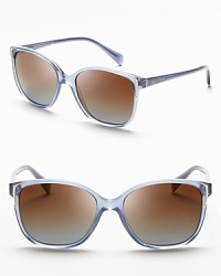 Prada updates the cat eye in a rounded, softened silhouette in a blue that is perfect paired with this season's key item: the denim jacket. Prada updates the cat eye in a rounded, softened silhouette in a blue that is perfect paired with this season's key item: the denim jacket.