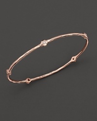 From the Rosé collection, a five-diamond hammered bangle. Designed by Ippolita. From the Rosé collection, a five-diamond hammered bangle. Designed by Ippolita.