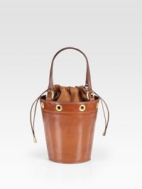 Rimmed in bold grommets, this stunning bucket-shaped bag of rich saddle leather has a drawstring top of velvety suede.Double top handles, 5½ drop Drawstring top closure Suede lining 4½W X 7H X 18D Made in Italy Rimmed in bold grommets, this stunning bucket-shaped bag of rich saddle leather has a drawstring top of velvety suede.Double top handles, 5½ drop Drawstring top closure Suede lining 4½W X 7H X 18D Made in Italy