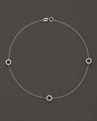 Diamonds sparkle from the circle stations on this dainty 14K white gold ankle bracelet. Diamonds sparkle from the circle stations on this dainty 14K white gold ankle bracelet.