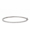 Keep your jewelry simple with Crislu's gold vermeil-finished bangle. When it's time to make a statement, layer this basic piece with similar styles for a sparkly stack-up.