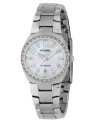 Pretty details make all the difference on this elegant watch from Fossil. Stainless steel bracelet and case. Swarovski crystal bezel. Mother-of-pearl dial with logo, date window at 6 o'clock and silvertone numerals at 2, 4, 8, 10 and 12 o'clock paired with sparkling Swarovski crystals. Water resistant to 100 meters. Eleven-year limited warranty. Comes packaged in a collectible tin. Pretty details make all the difference on this elegant watch from Fossil. Stainless steel bracelet and case. Swarovski crystal bezel. Mother-of-pearl dial with logo, date window at 6 o'clock and silvertone numerals at 2, 4, 8, 10 and 12 o'clock paired with sparkling Swarovski crystals. Water resistant to 100 meters. Eleven-year limited warranty. Comes packaged in a collectible tin.
