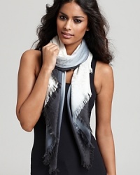 A stylish dip-dyed scarf accented by subtle Tory Burch logo print. A stylish dip-dyed scarf accented by subtle Tory Burch logo print.