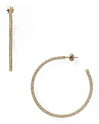This pair of Juicy Couture hoops is a jewel box staple, simply styled in gold plate with a rim of subtle, sparkling stones. This pair of Juicy Couture hoops is a jewel box staple, simply styled in gold plate with a rim of subtle, sparkling stones.