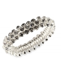 An elegant finishing touch from Anne Klein. Glass and plastic stones in clear hues lend a look of sophistication to this bracelet. Crafted in silver tone mixed metal. Approximate diameter: 2 inches. Stretches to fit wrist. An elegant finishing touch from Anne Klein. Glass and plastic stones in clear hues lend a look of sophistication to this bracelet. Crafted in silver tone mixed metal. Approximate diameter: 2 inches. Stretches to fit wrist.