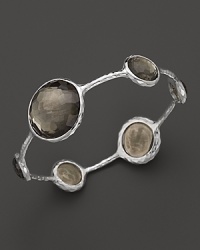 Faceted pyrite doubles dot a sterling silver bangle from Ippolita. Faceted pyrite doubles dot a sterling silver bangle from Ippolita.