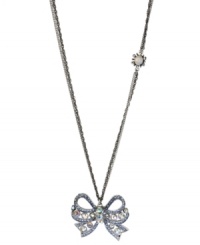 Take a bow. Betsey Johnson's silver tone mixed metal necklace features a sparkling bow pendant accented with clear and blue crystals, while a glass opal gem with crystal accents adorns the double silver tone chain. Approximate length: 32 inches + 3-inch extender. Approximate drop length: 1-3/4 inches. Approximate drop width: 2 inches. Take a bow. Betsey Johnson's silver tone mixed metal necklace features a sparkling bow pendant accented with clear and blue crystals, while a glass opal gem with crystal accents adorns the double silver tone chain. Approximate length: 32 inches + 3-inch extender. Approximate drop length: 1-3/4 inches. Approximate drop width: 2 inches.