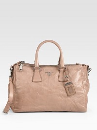 Antiqued nappa leather in a roomy zip-top carryall with metal logo detail.Double top handles, 6 dropDetachable adjustable shoulder strap, 16¾-21 dropDouble top zip compartmentsProtective metal feetOne inside zip pocketThree inside open pocketsLeather lining14½W X 11H X 6¼DMade in Italy Antiqued nappa leather in a roomy zip-top carryall with metal logo detail.Double top handles, 6 dropDetachable adjustable shoulder strap, 16¾-21 dropDouble top zip compartmentsProtective metal feetOne inside zip pocketThree inside open pocketsLeather lining14½W X 11H X 6¼DMade in Italy
