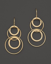 Interlocking hoops of 14K. yellow gold form a striking pattern. Interlocking hoops of 14K. yellow gold form a striking pattern.