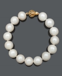 Refine your look with simple and sophisticated pearls. Bracelet features A+ cultured freshwater pearls (11-13 mm) with an ornate 14k gold circular clasp. Approximate length: 7-1/2 inches. Refine your look with simple and sophisticated pearls. Bracelet features A+ cultured freshwater pearls (11-13 mm) with an ornate 14k gold circular clasp. Approximate length: 7-1/2 inches.