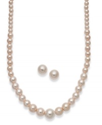 Perfectly pink. This pretty jewelry set features a graduated strand of simulated pink pearls and a matching pair of stud earrings. Setting crafted from gold tone mixed metal. Approximate length: 16 inches + 2-inch extender. Approximate diameter: 1/3 inch. Jewelry set comes packaged in a signature blue gift box. Perfectly pink. This pretty jewelry set features a graduated strand of simulated pink pearls and a matching pair of stud earrings. Setting crafted from gold tone mixed metal. Approximate length: 16 inches + 2-inch extender. Approximate diameter: 1/3 inch. Jewelry set comes packaged in a signature blue gift box.
