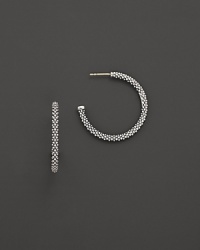 Signature sterling silver Caviar™ beaded earrings, designed by Lagos. Signature sterling silver Caviar™ beaded earrings, designed by Lagos.
