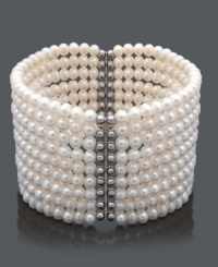 Layer your wrist in nine, elegant rows of pearl. This bracelet features cultured freshwater pearls (4-5 mm) in a chic cuff design. Crafted in sterling silver. Bracelet stretches to fit wrist. Approximate length: 7 inches. Layer your wrist in nine, elegant rows of pearl. This bracelet features cultured freshwater pearls (4-5 mm) in a chic cuff design. Crafted in sterling silver. Bracelet stretches to fit wrist. Approximate length: 7 inches.