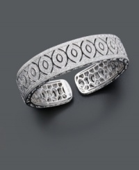 Slip on style with extraordinary sparkle. This dazzling milgrain bangle slides easily over the wrist and features an open-cut oval design covered in sparkling diamond (1/2 ct. t.w.). Bracelet crafted in sterling silver. Approximate diameter: 2-1/2 inches. Slip on style with extraordinary sparkle. This dazzling milgrain bangle slides easily over the wrist and features an open-cut oval design covered in sparkling diamond (1/2 ct. t.w.). Bracelet crafted in sterling silver. Approximate diameter: 2-1/2 inches.