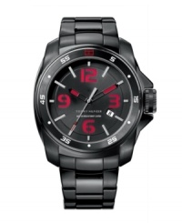 Daring red accents add edge to this sturdy sport watch by Tommy Hilfiger. Black silicone bracelet and round black ion-plated stainless steel case. White numerals and red flag logo at bezel. Brushed black dial features silver tone stick indices, red numerals at twelve, three, six and nine o'clock, date window at four o'clock, three red-tipped hands and text logo. Quartz movement. Water resistant to 50 meters. Ten-year limited warranty. Daring red accents add edge to this sturdy sport watch by Tommy Hilfiger. Black silicone bracelet and round black ion-plated stainless steel case. White numerals and red flag logo at bezel. Brushed black dial features silver tone stick indices, red numerals at twelve, three, six and nine o'clock, date window at four o'clock, three red-tipped hands and text logo. Quartz movement. Water resistant to 50 meters. Ten-year limited warranty.