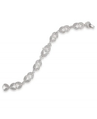 Define and refine your style in this elegant bracelet by Carolee. Sparkling glass stones highlight an ornate link pattern crafted in silver tone mixed metal. Approximate length: 7-1/4 inches. Define and refine your style in this elegant bracelet by Carolee. Sparkling glass stones highlight an ornate link pattern crafted in silver tone mixed metal. Approximate length: 7-1/4 inches.