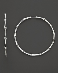From the Bamboo collection, large continuous hoop earrings inspired from bamboo, designed by John Hardy. From the Bamboo collection, large continuous hoop earrings inspired from bamboo, designed by John Hardy.
