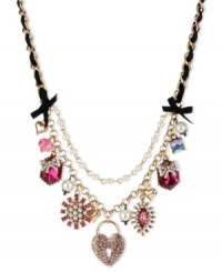 Betsey Johnson has the key to your heart. This frontal necklace flaunts heart lock charms with pink-colored crystal accents, fuchsia-colored crystal gems, glass pearls and faceted fuchsia bead. Finished with a black grosgrain ribbon, glass pearl chain and bubble hearts. Crafted in antiqued gold tone mixed metal. Approximate length: 16 inches + 3-inch extender. Approximate drop: 2-1/4 inches. Betsey Johnson has the key to your heart. This frontal necklace flaunts heart lock charms with pink-colored crystal accents, fuchsia-colored crystal gems, glass pearls and faceted fuchsia bead. Finished with a black grosgrain ribbon, glass pearl chain and bubble hearts. Crafted in antiqued gold tone mixed metal. Approximate length: 16 inches + 3-inch extender. Approximate drop: 2-1/4 inches.