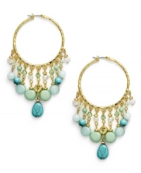 Think spring. The pastel combination of reconstituted turquoise, freshwater pearls (4 mm), and jade-colored beads exude serenity on the Green Valley hoop earrings from Lauren by Ralph Lauren. Setting and click-it clasp crafted in gold tone mixed metal. Approximate drop: 3 inches. Approximate diameter: 1-1/4 inches. Think spring. The pastel combination of reconstituted turquoise, freshwater pearls (4 mm), and jade-colored beads exude serenity on the Green Valley hoop earrings from Lauren by Ralph Lauren. Setting and click-it clasp crafted in gold tone mixed metal. Approximate drop: 3 inches. Approximate diameter: 1-1/4 inches.