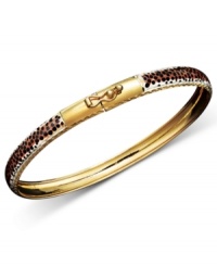 Put a fierce, new spin on your style. This wild bangle features a leopard print enamel surface with diamond-cut edging. Crafted in 14k gold over sterling silver and sterling silver. Approximate diameter: 2-1/2 inches. Put a fierce, new spin on your style. This wild bangle features a leopard print enamel surface with diamond-cut edging. Crafted in 14k gold over sterling silver and sterling silver. Approximate diameter: 2-1/2 inches.